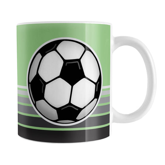 Gray Gradient Lined Green Soccer Ball Mug (11oz) at Amy's Coffee Mugs. A ceramic coffee mug designed with a big soccer ball on both sides of the mug over gradient black to gray lines along the bottom over a green background color that wraps around the mug up to the handle.