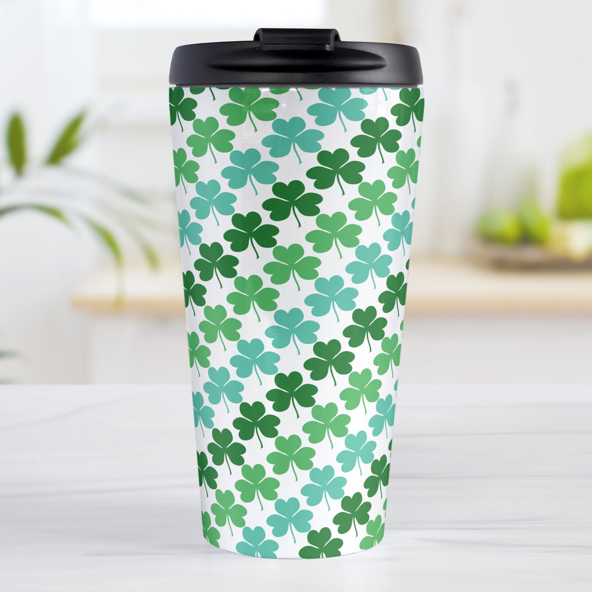 Green and Teal Clovers Travel Mug (15oz, stainless steel insulated) at Amy's Coffee Mugs. A travel mug designed with a pattern of two-tone green and teal clovers (shamrocks) that wraps around the travel mug.