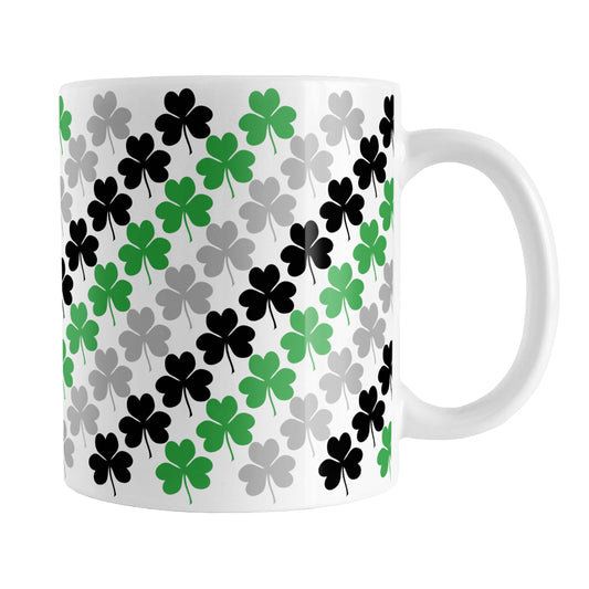 Green Black and Gray Clovers Mug (11oz) at Amy's Coffee Mugs. A ceramic coffee mug designed with a pattern of green, black, and gray clovers (shamrocks) that wraps around the mug up to the handle.
