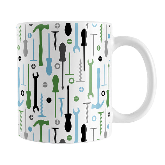 Green Blue Tools Pattern Mug (11oz) at Amy's Coffee Mugs. A ceramic coffee mug with a modern style pattern of tools in green, blue, black, and gray over white that wraps around the mug to the handle. Perfect for any handyman or contractor.