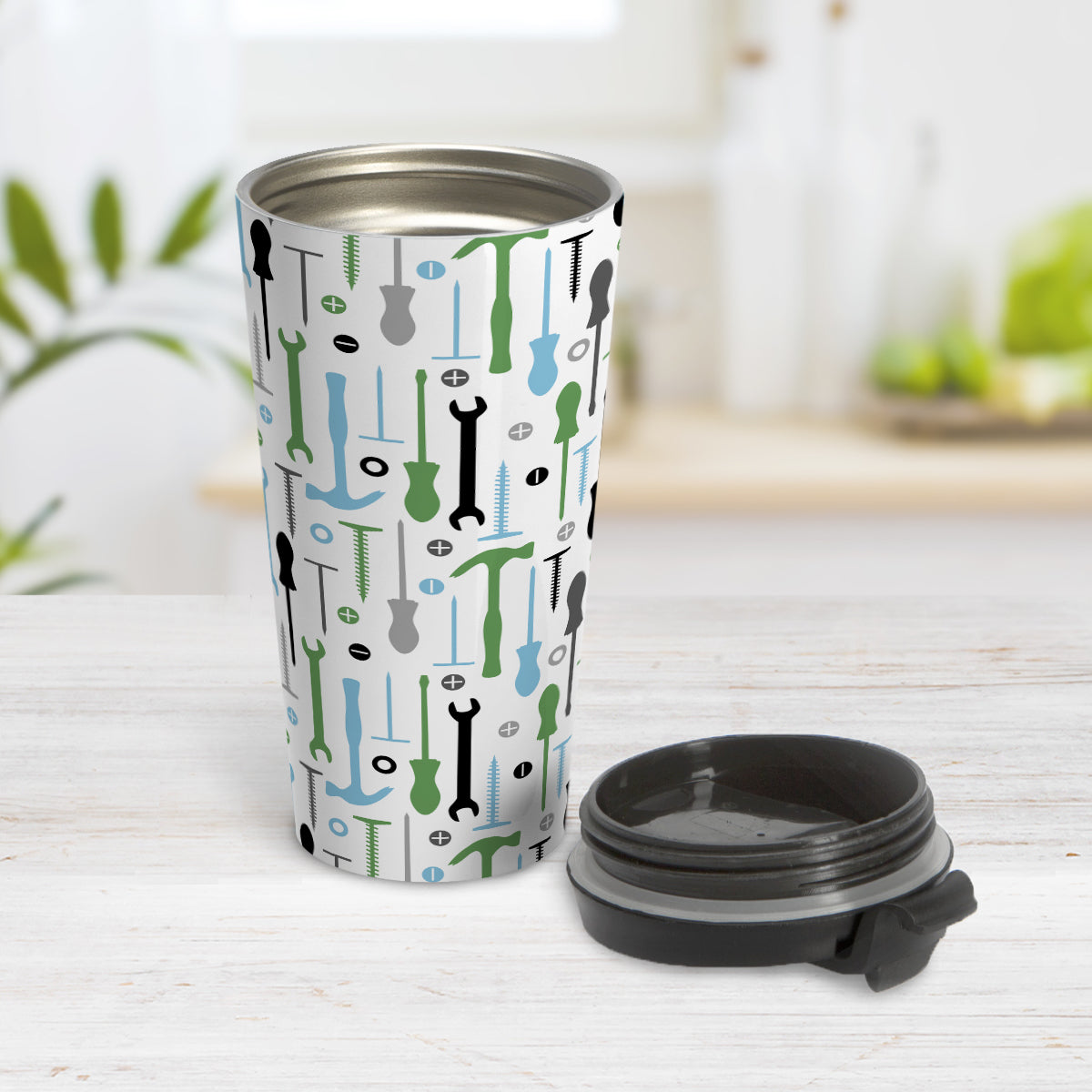 Green Blue Tools Pattern Travel Mug (15oz) at Amy's Coffee Mugs. A stainless steel insulated travel mug with a modern style pattern of tools in green, blue, black, and gray over white that wraps around the mug. Perfect for any handyman or contractor.