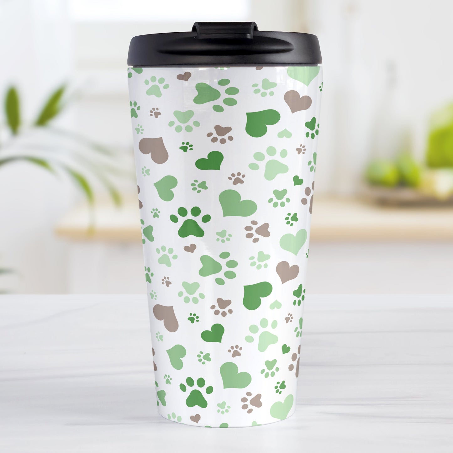 Green Hearts and Paw Prints Travel Mug (15oz) at Amy's Coffee Mugs. A stainless steel travel mug designed with a pattern of hearts and paw prints in brown and different shades of green that wraps around the mug. This travel mug is perfect for people love dogs and cute paw print designs.