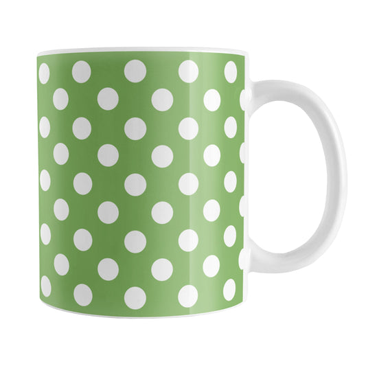 Green Polka Dot Mug (11oz) at Amy's Coffee Mugs. A ceramic coffee mug designed with a pattern of white polka dots over a green background color that wraps around the mug up to the handle.