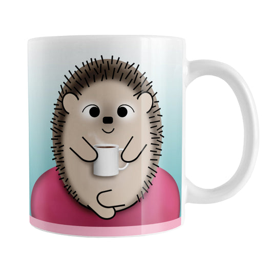 My Time to Relax - Cute Pink Coffee Hedgehog Mug (11oz) at Amy's Coffee Mugs. A ceramic coffee mug designed with relaxation in mind, with an adorable happy hedgehog holding a cup of coffee, sitting in a fuchsia pink bean bag chair on both sides of the mug over a turquoise blue gradient background that wraps around the mug up to the handle.