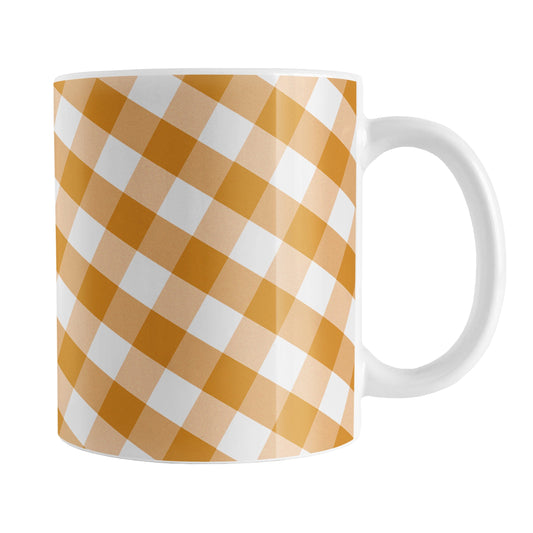 Orange Gingham Mug (11oz) at Amy's Coffee Mugs. A ceramic coffee mug designed with a slanted white and orange gingham pattern that wraps around the mug up to the handle.