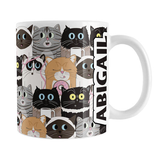 Personalized Cute Cat Stack Pattern Mug (11oz) at Amy's Coffee Mugs. A ceramic coffee mug designed with an illustrated pattern of different breeds of cats with different fun expressions, with yarn, coffee, and donuts. This stacked pattern of cats wraps around the ceramic mug to the handle where your name is custom printed in black on white vertically at the edge of the design.