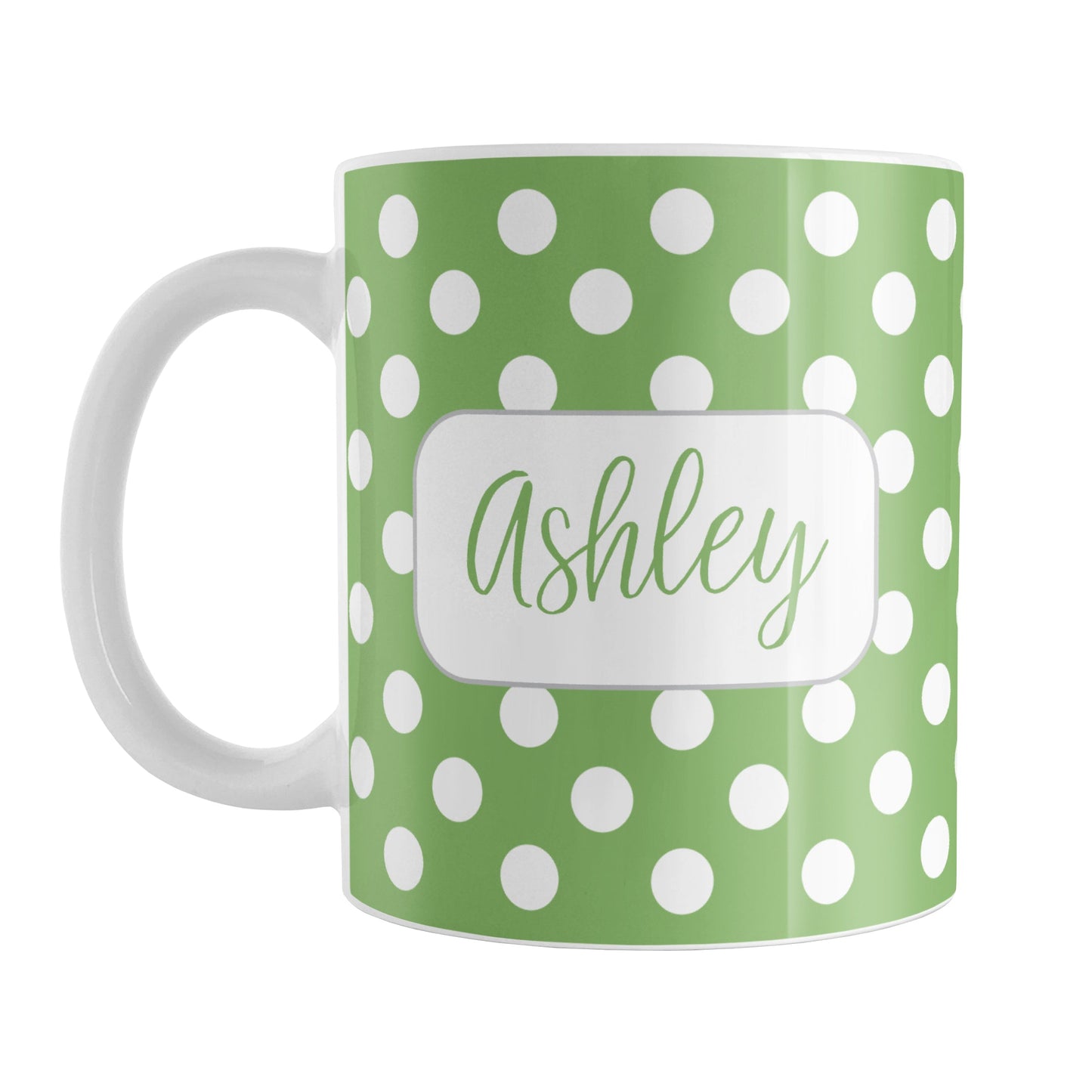 Personalized Green Polka Dot Mug (11oz) at Amy's Coffee Mugs. A ceramic coffee mug designed with a pattern of white polka dots over a green background color that wraps around the mug up to the handle. Your name is personalized in a cute green script font in a white frame design on both sides of the mug over the polka dot pattern.