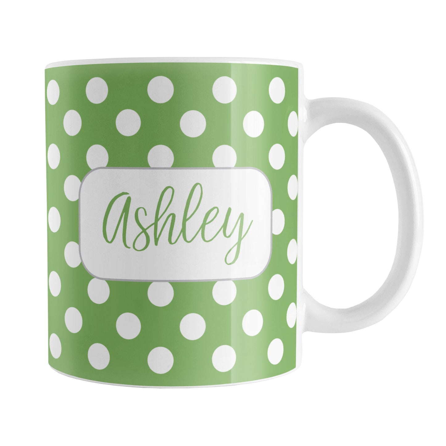 Personalized Green Polka Dot Mug (11oz) at Amy's Coffee Mugs. A ceramic coffee mug designed with a pattern of white polka dots over a green background color that wraps around the mug up to the handle. Your name is personalized in a cute green script font in a white frame design on both sides of the mug over the polka dot pattern.