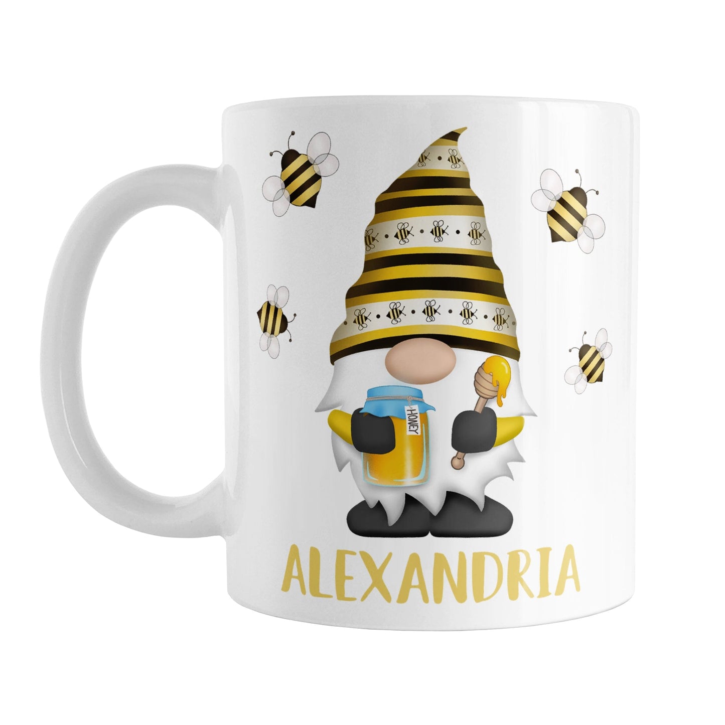 Personalized Honey Bee Gnome Mug (11oz) at Amy's Coffee Mugs. A ceramic coffee mug designed with a gnome wearing an adorable hat with black and yellow stripes and bees, holding a jar of honey and a honey dipper, with bees flying around the gnome. Your name is personalized in a fun yellow font below the gnome, making this a great gift. This cute honey bee gnome illustration and name are on both sides of the mug.