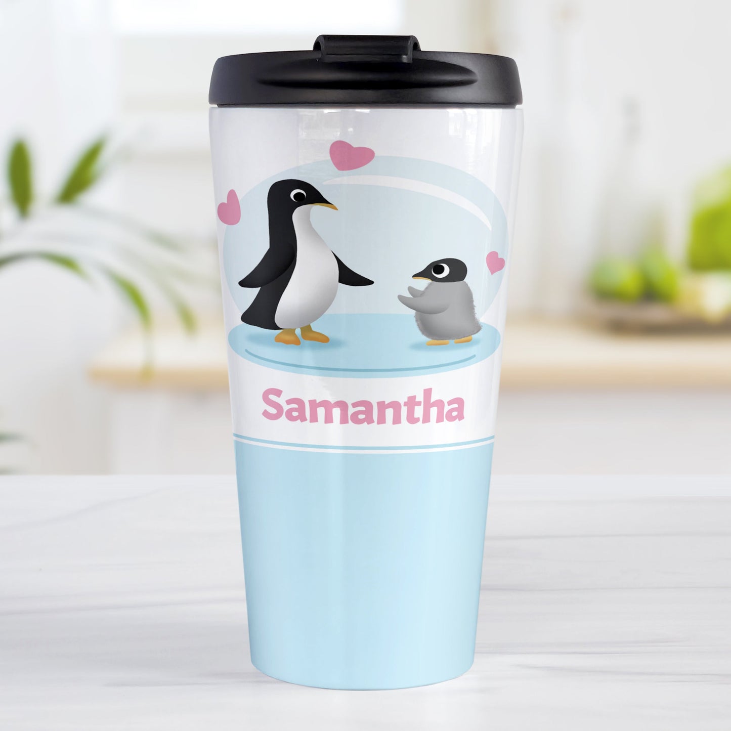 Personalized My Little Penguin Travel Mug (15oz, stainless steel insulated) at Amy's Coffee Mugs. A travel mug designed with an illustration of a mommy or daddy penguin with a little baby penguin over a blue background design with three pink hearts above them. Your name is personalized in pink below the adorable penguins.