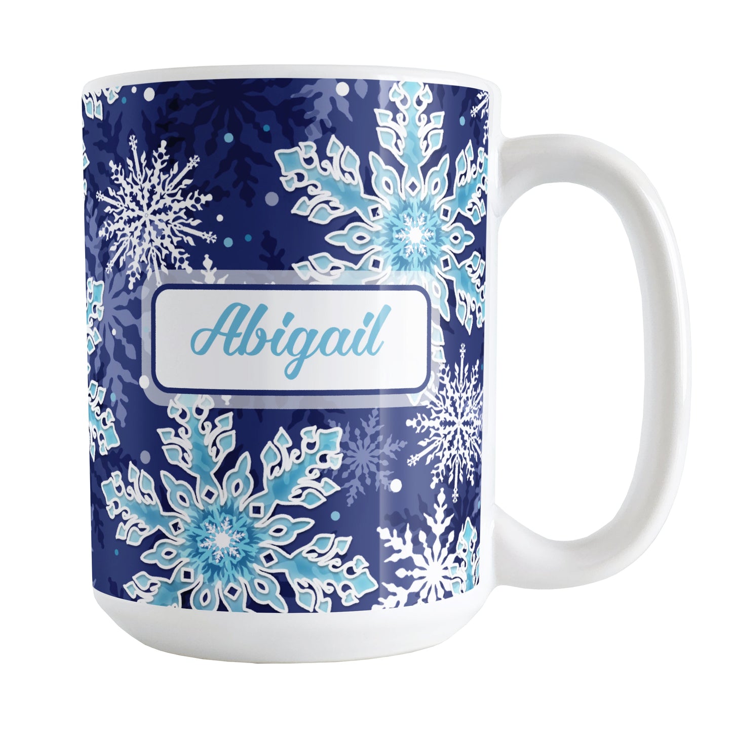Personalized Navy Blue Aqua Snowflake Winter Mug (15oz) at Amy's Coffee Mugs. A ceramic coffee mug designed with a pattern of aqua blue and white snowflakes over a navy blue background color that wraps around the mug to the handle. Your name is personalized in blue in a white frame design on both sides of the mug over the snowflakes pattern.