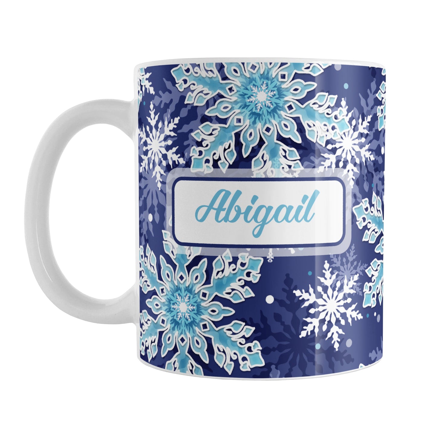 Personalized Navy Blue Aqua Snowflake Winter Mug (11oz) at Amy's Coffee Mugs. A ceramic coffee mug designed with a pattern of aqua blue and white snowflakes over a navy blue background color that wraps around the mug to the handle. Your name is personalized in blue in a white frame design on both sides of the mug over the snowflakes pattern.