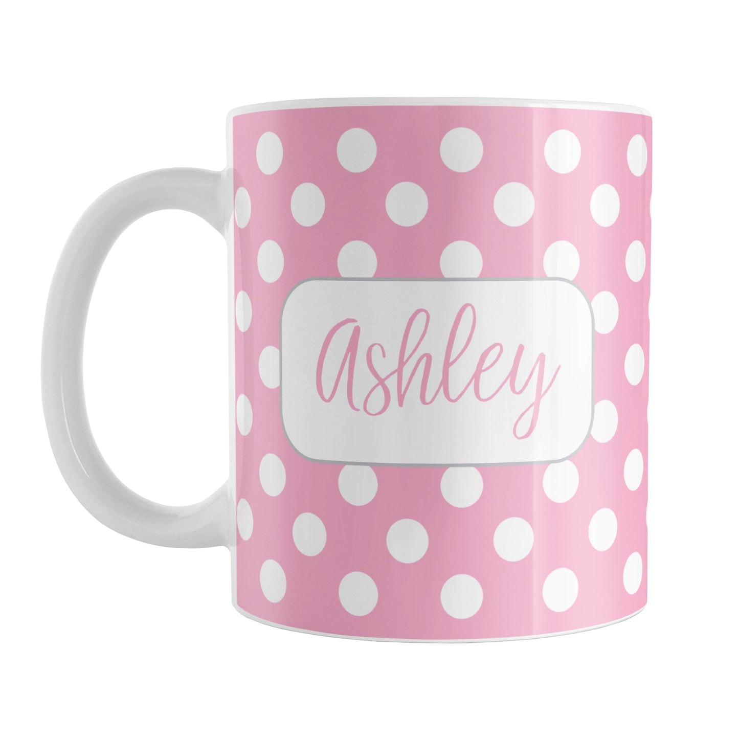 Personalized Pink Polka Dot Mug (11oz) at Amy's Coffee Mugs. A ceramic coffee mug designed with a pattern of white polka dots over a pink background color that wraps around the mug up to the handle. Your name is personalized in a cute pink script font in a white frame design on both sides of the mug over the polka dot pattern.