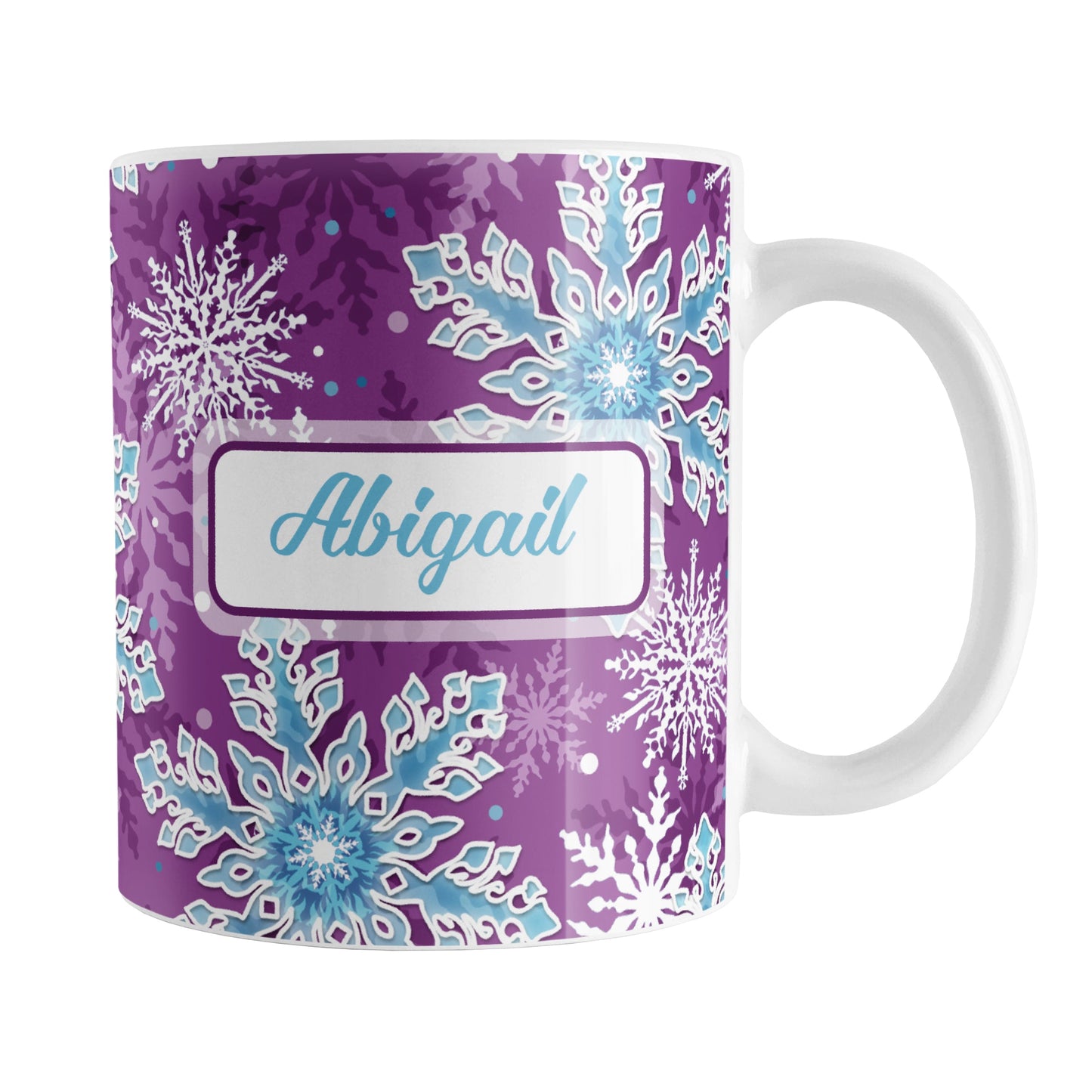 Personalized Purple Blue Snowflake Winter Mug (11oz) at Amy's Coffee Mugs. A ceramic coffee mug designed with a pattern of aqua blue and white snowflakes over a purple background color that wraps around the mug to the handle. Your name is custom printed in an aqua blue script font on both sides of this winter themed mug.