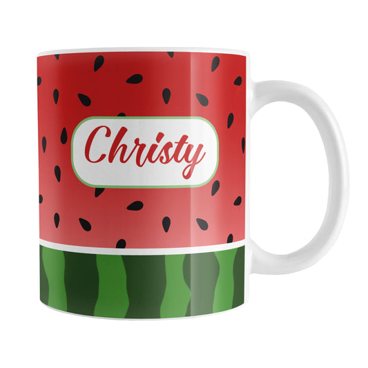 Personalized Red and Green Watermelon Mug (11oz) at Amy's Coffee Mugs. A ceramic coffee mug designed with a watermelon black seed pattern complemented by a green stripe watermelon pattern along the bottom. This fruity design wraps around the mug up to the handle. Your personalized name is custom printed in a red script font inside a white rectangular design on both sides of the mug.