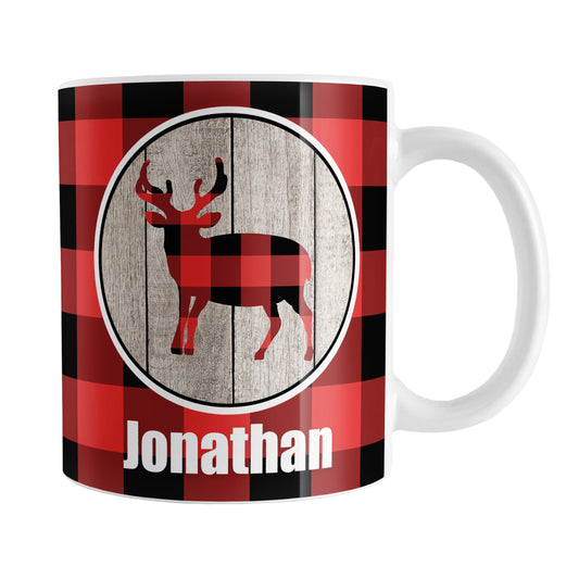 Personalized Rustic Red Buffalo Plaid Deer Mug (11oz) at Amy's Coffee Mugs. A ceramic coffee mug designed with a buffalo plaid deer on a rustic wood circle illustration on both sides of the mug over a red and black buffalo plaid pattern that wraps around the mug up to the handle. Your name is custom-printed in white below the deer design.