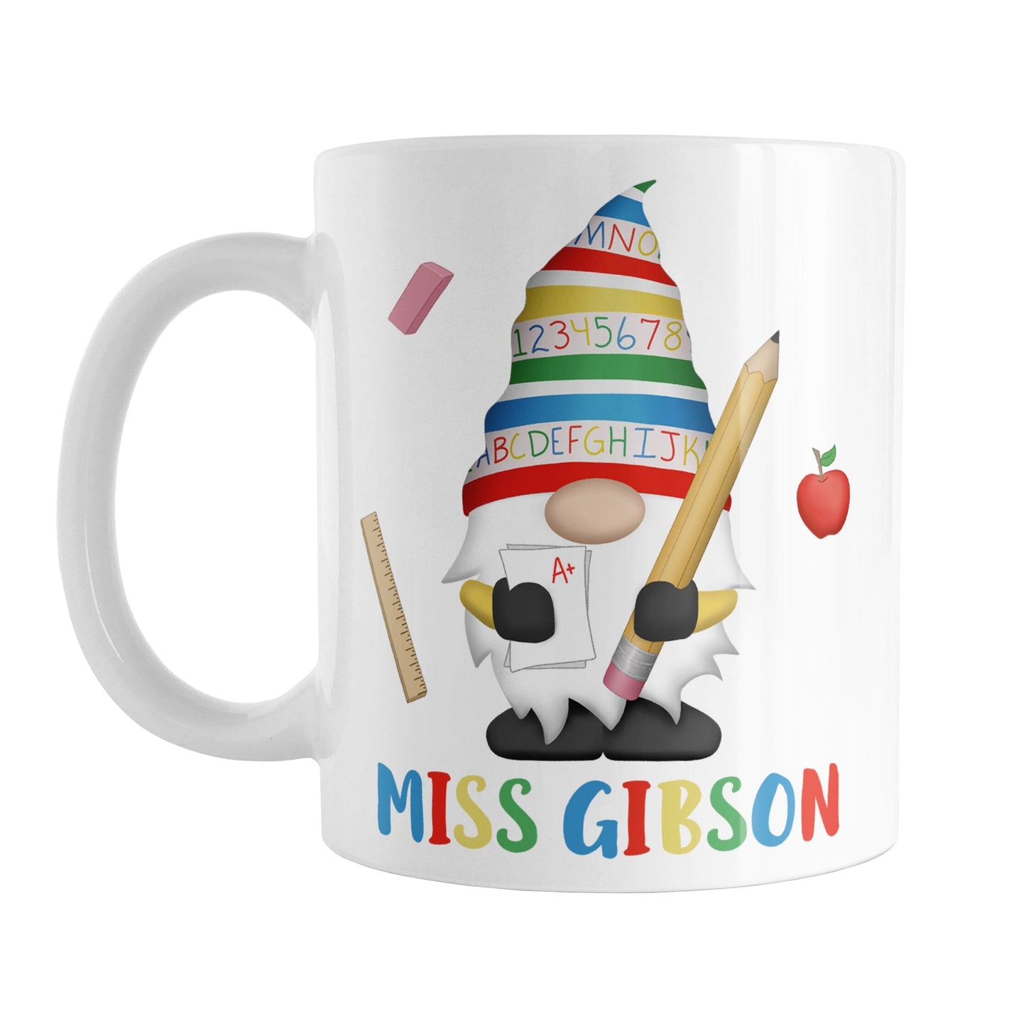 Personalized School Teacher Gnome Mug (11oz) at Amy's Coffee Mugs. A ceramic coffee mug designed with an illustration of an adorable gnome wearing a festive hat with numbers and letters in primary colors and holding a large oversized pencil and graded A+ paper. Around the gnome are an eraser, a ruler, and a red apple. Your personalized name or your teacher's name is custom printed below the gnome in blue, red, yellow, and green alternating colored letters.