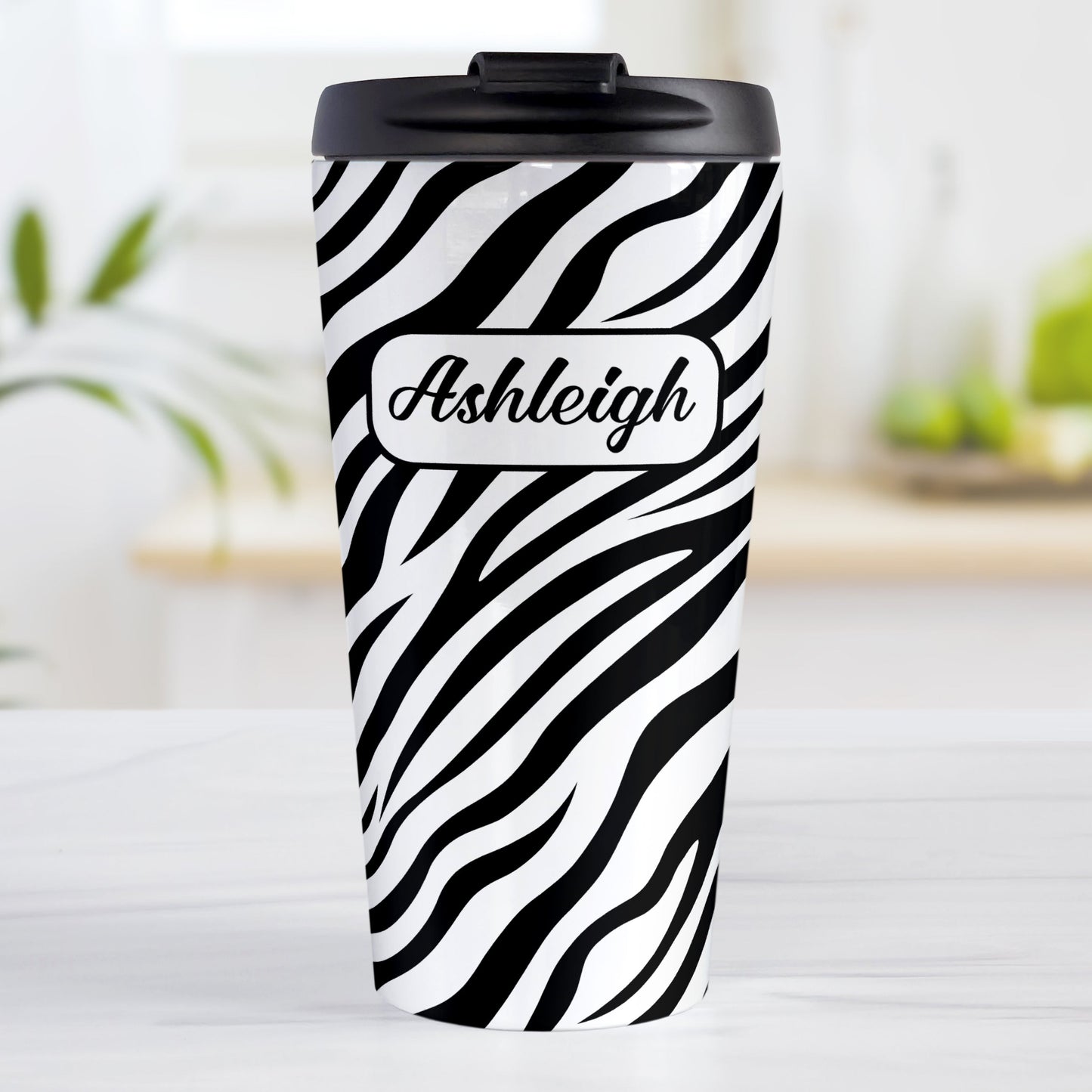 Personalized Zebra Print Pattern Travel Mug (15oz, stainless steel insulated) at Amy's Coffee Mugs. A travel mug designed with an animal print pattern of black and white zebra stripes that wraps around the travel mug. Your name is custom-printed in a stylish black script font in a white rectangular design over the zebra print pattern.