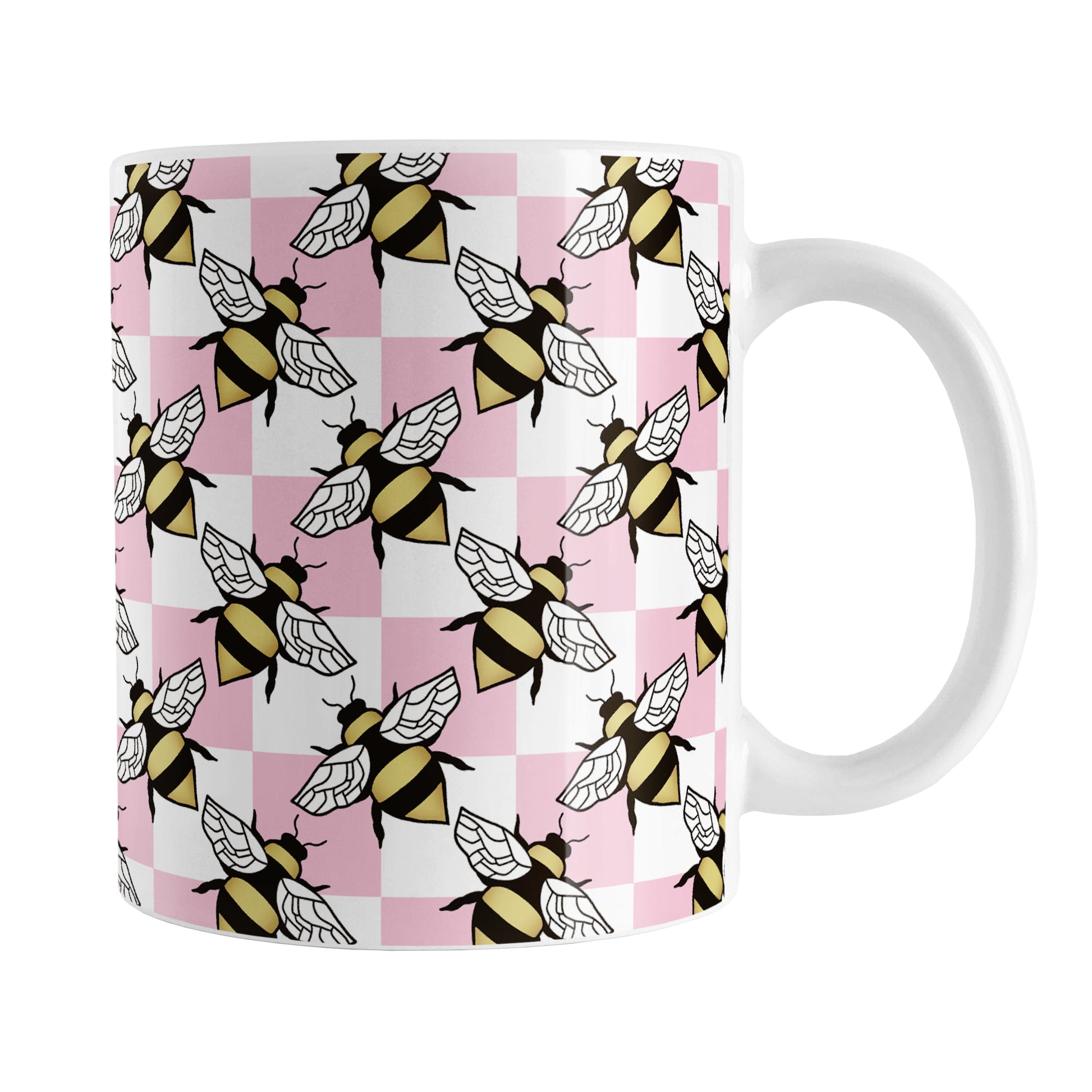 Pink Checkered Bee Mug (11oz) at Amy's Coffee Mugs. A ceramic coffee mug designed with a pink and white checkered pattern adorned with alternately facing bees over the check pattern. This design wraps around the mug up to the handle.