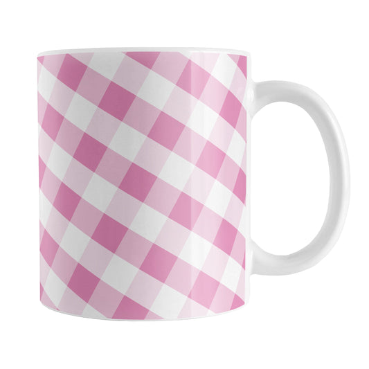 Pink Gingham Mug (11oz) at Amy's Coffee Mugs. A ceramic coffee mug designed with a slanted white and pink gingham pattern that wraps around the mug up to the handle.