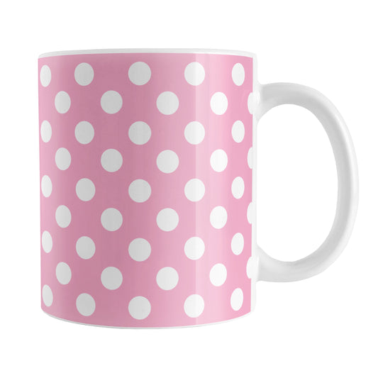 Pink Polka Dot Mug (11oz) at Amy's Coffee Mugs. A ceramic coffee mug designed with a pattern of white polka dots over a pink background color that wraps around the mug up to the handle.