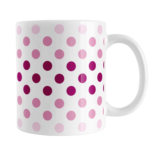 Polka Dots in Pink Mug (11oz) at Amy's Coffee Mugs. A ceramic coffee mug designed with polka dots in different shades of pink, with the darker pink color across the middle and the lighter pink along the top and bottom, in a pattern that wraps around the mug to the handle.