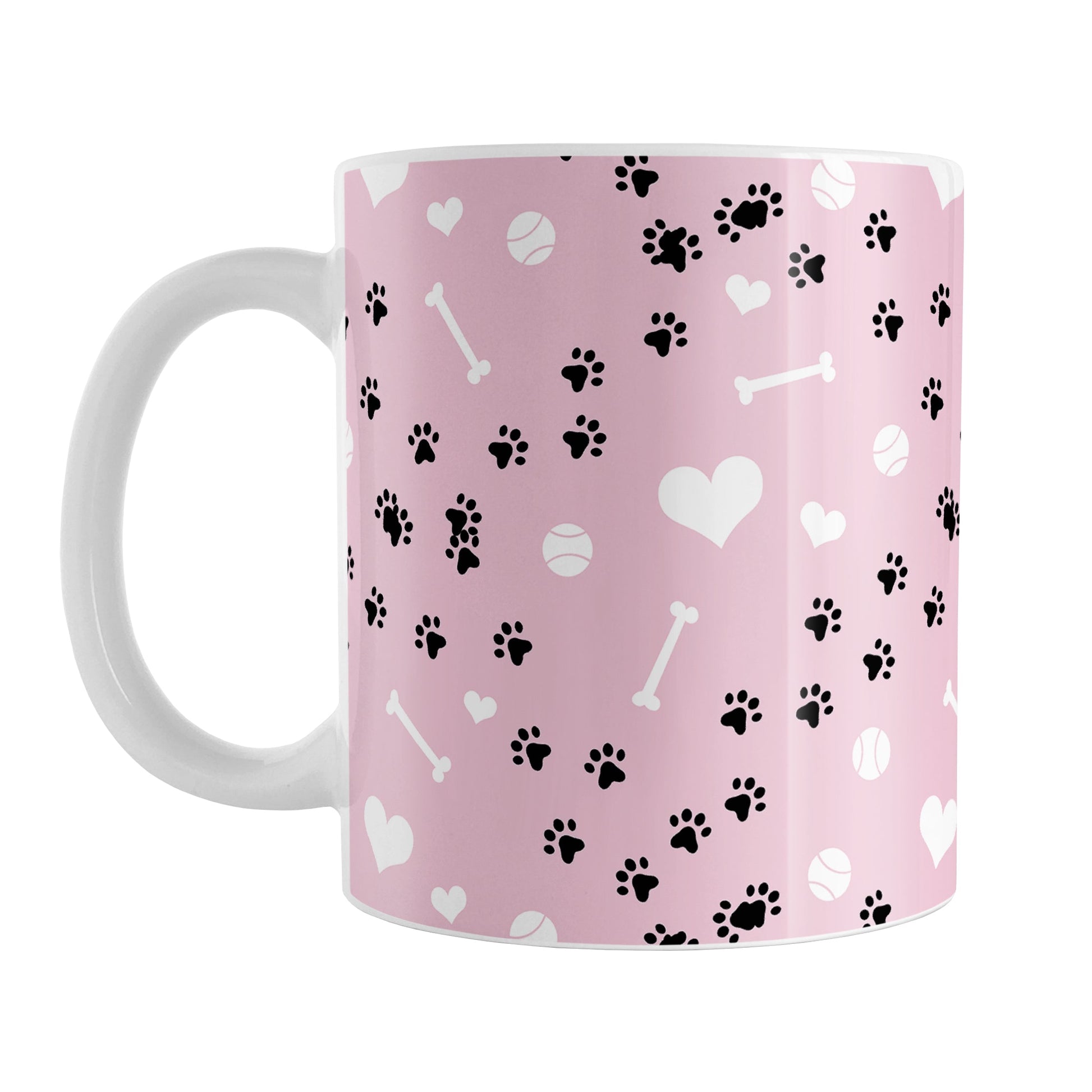 Puppy Run Pink Dog Mug (11oz) at Amy's Coffee Mugs. A ceramic coffee mug designed with a pattern of chaotic tracks of puppy paw prints running around the mug with white dog bones, balls, and hearts over a light pink background. This mug is perfect for people who love the chaotic play of puppies, love dogs, and like pink mugs.