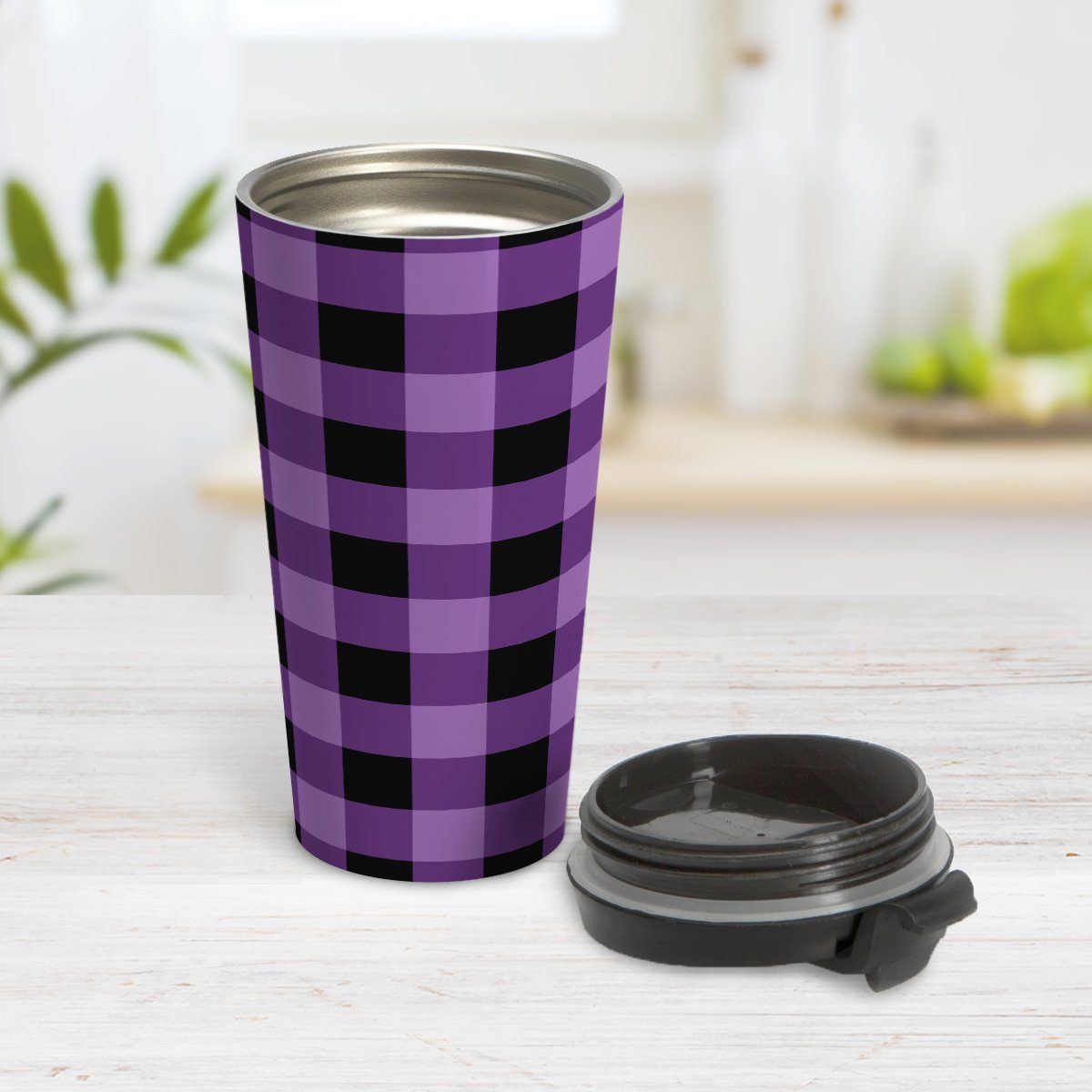 Purple and Black Buffalo Plaid Travel Mug at Amy's Coffee Mugs. A travel mug designed with a purple and black buffalo plaid (buffalo check) pattern that wraps around the mug. Photo shows the mug open on a table with its lid beside it.