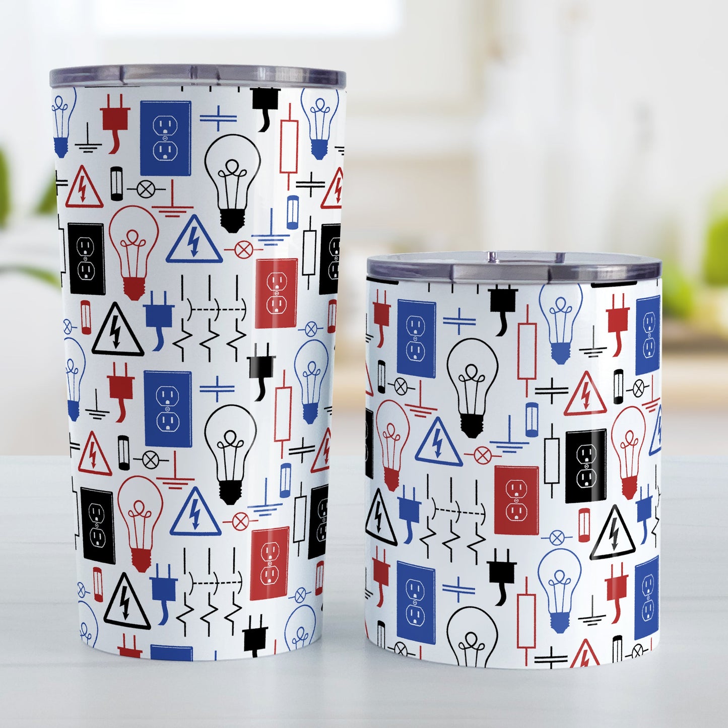 Red Blue Electrical Electrician Tumbler Cup (20oz and 10oz) at Amy's Coffee Mugs. Stainless steel insulated tumbler cups designed with an electrical pattern with light bulbs, wall sockets, plugs, fuses, and other electricity symbols in red, blue, and black colors that wraps around the cups. These cups are perfect for people who work a trade as an electrician, love working with electronics, and working in electrical engineering. Photo shows both sized cups next to each other.
