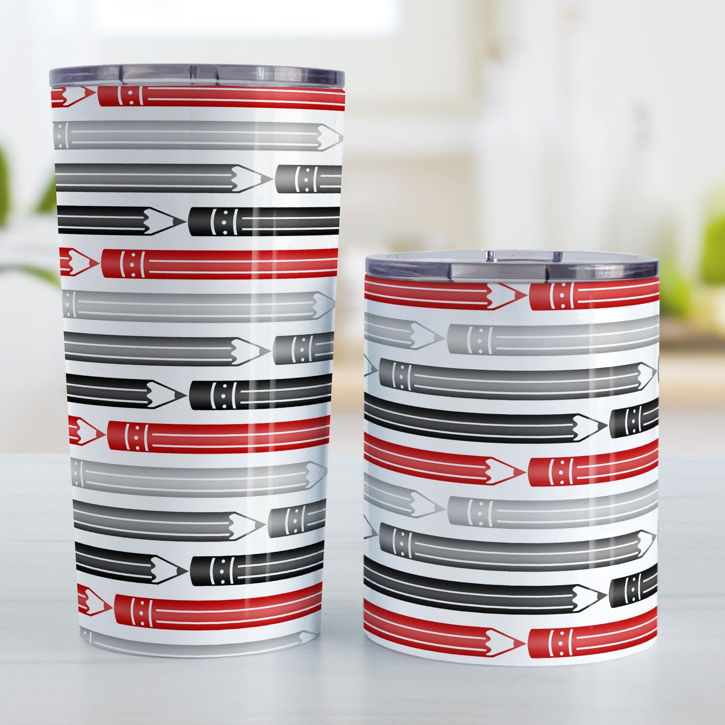 Red Gray Black Pencils Pattern Tumbler Cups (20oz or 10oz) at Amy's Coffee Mugs. Stainless steel tumbler cups designed with horizontal pencils in red, gray, and black, stacked in a pattern that wraps around the cup. Photo shows both sized cups next to each other.