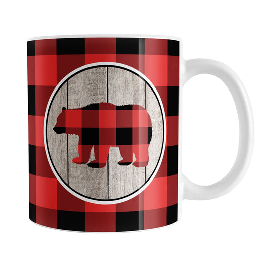 Rustic Red Buffalo Plaid Bear Mug (11oz) at Amy's Coffee Mugs. A ceramic coffee mug designed with a buffalo plaid bear on a rustic wood circle illustration on both sides of the mug over a red and black buffalo plaid pattern that wraps around the mug up to the handle.