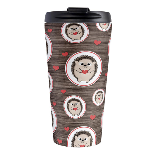 Rustic Wood Red Heart Hedgehog Travel Mug (15oz, stainless steel insulated) at Amy's Coffee Mugs. A travel mug designed with a pattern of hedgehogs holding red hearts in ovals outlined in red and scattered red hearts in a pattern over a rustic wood background design that wraps around the mug.