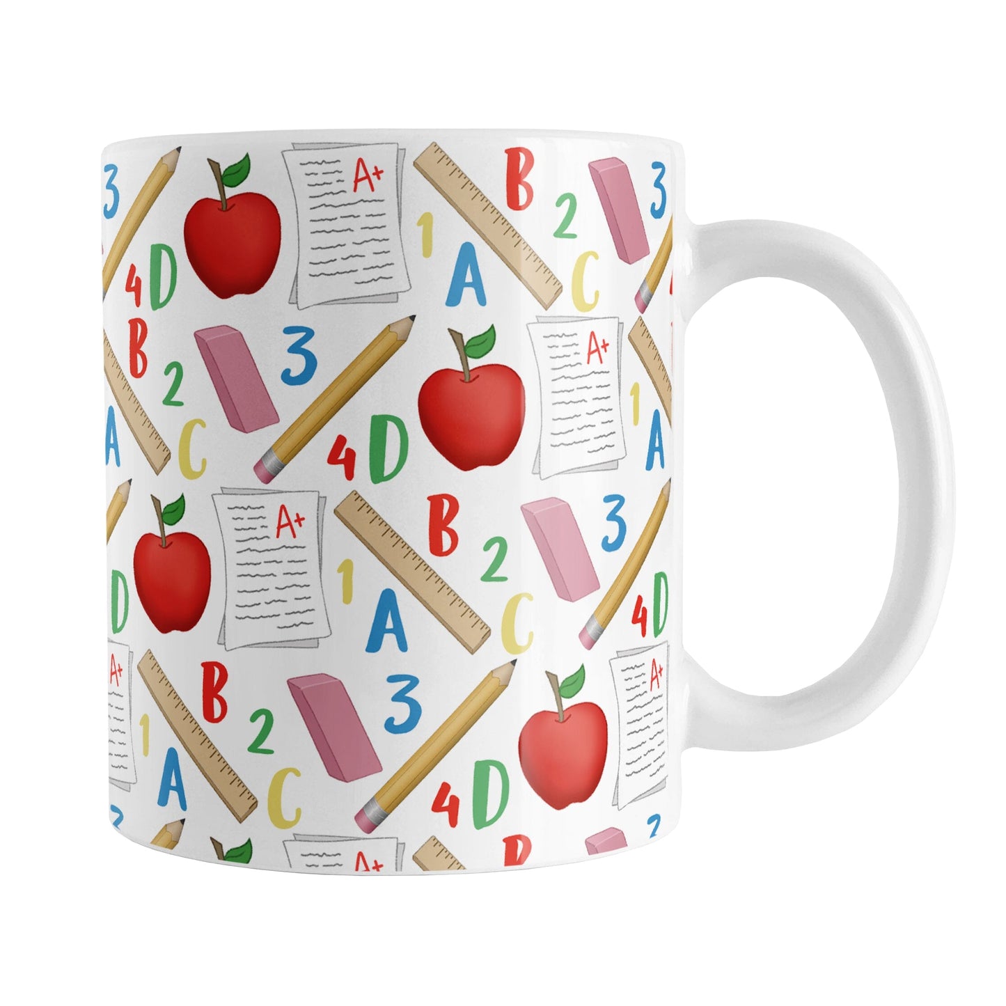 School Pattern Mug (11oz) at Amy's Coffee Mugs. A ceramic coffee mug designed with a school-themed pattern with apples, rulers, erasers, graded papers, numbers, and letters that wraps around the mug to the handle.