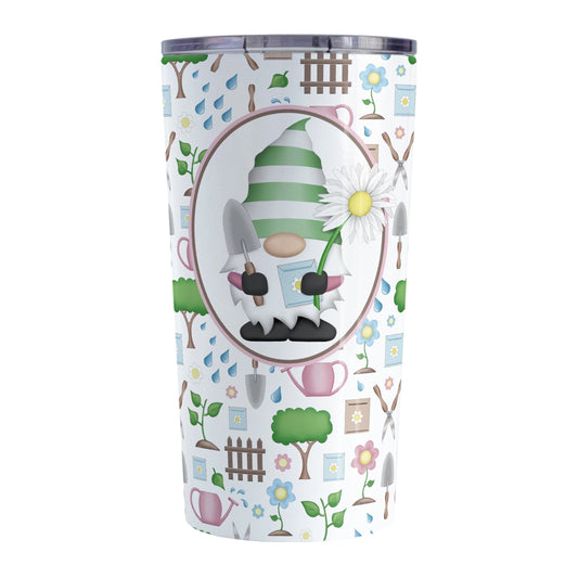 Spring Gnome Gardening Pattern Tumbler Cup (20oz) at Amy's Coffee Mugs. A stainless steel tumbler cup designed with an adorable spring gardening gnome holding an oversized daisy in a white oval over a springtime gardening pattern with trees, plants, flowers, seed packets, watering cans, fences, and gardening tools in spring colors such as pink, blue, green, and brown.