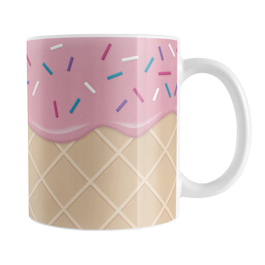 Strawberry Ice Cream Waffle Cone Mug (11oz) at Amy's Coffee Mugs. A ceramic coffee mug with a yummy looking dessert illustration of pink strawberry ice cream with sprinkles atop a waffle cone pattern in a design that wraps around the mug up to the handle.