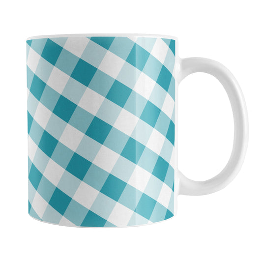 Turquoise Gingham Mug (11oz) at Amy's Coffee Mugs. A ceramic coffee mug designed with a slanted white and turquoise gingham pattern that wraps around the mug up to the handle.