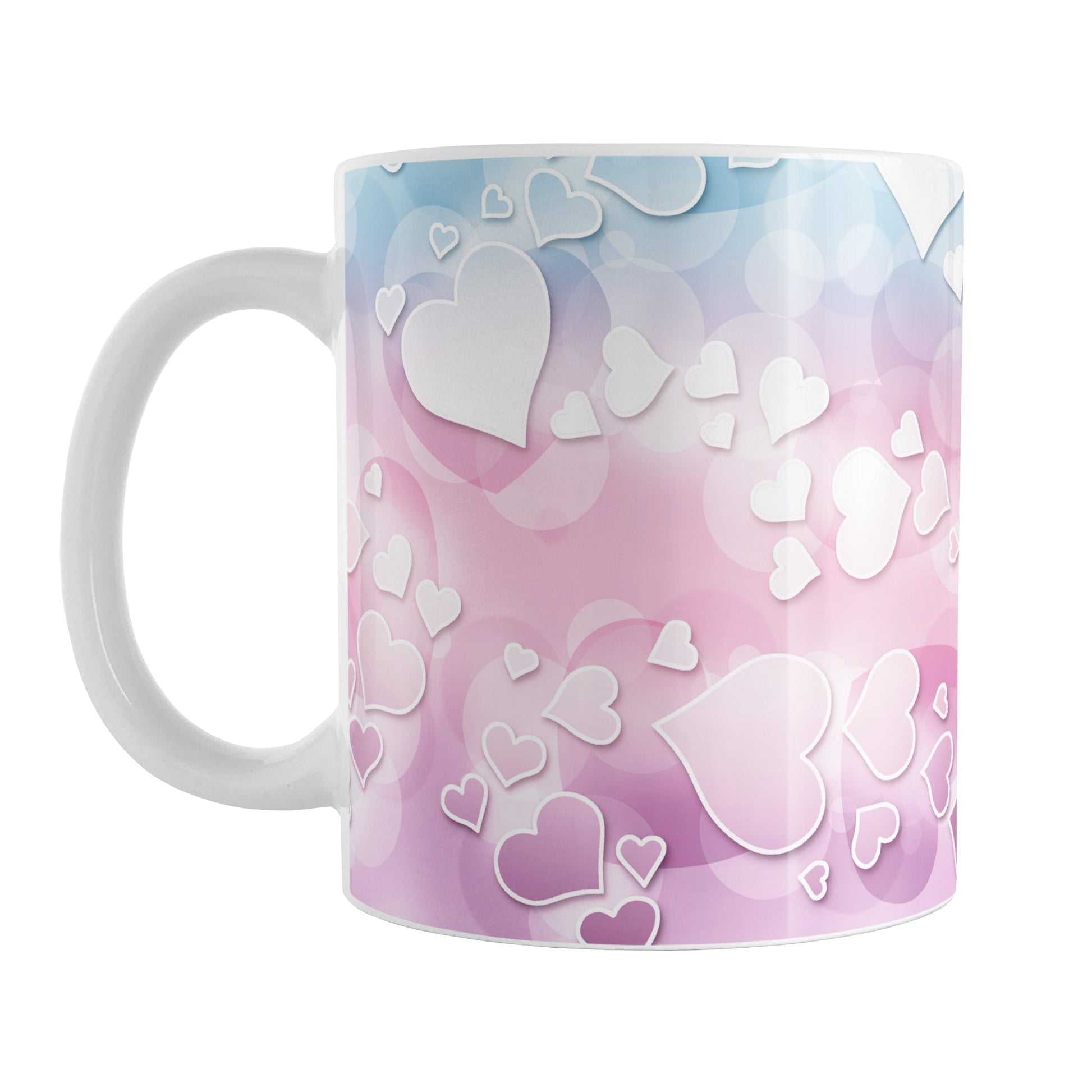 Whimsical Hearts Pattern Mug (11oz) at Amy's Coffee Mugs. A ceramic coffee mug designed with a whimsical pattern of hearts over a gradient bokeh background in pink, blue, and purple that wraps around the mug up to the handle.
