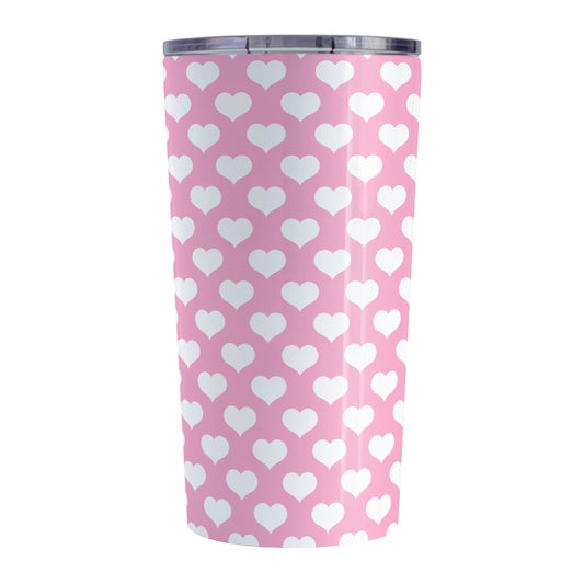 White Hearts Pattern Pink Tumbler Cup (20oz, stainless steel insulated) at Amy's Coffee Mugs. A tumbler cup designed with white hearts in a polka-dotted style pattern over a pink background color that wraps around the cup.