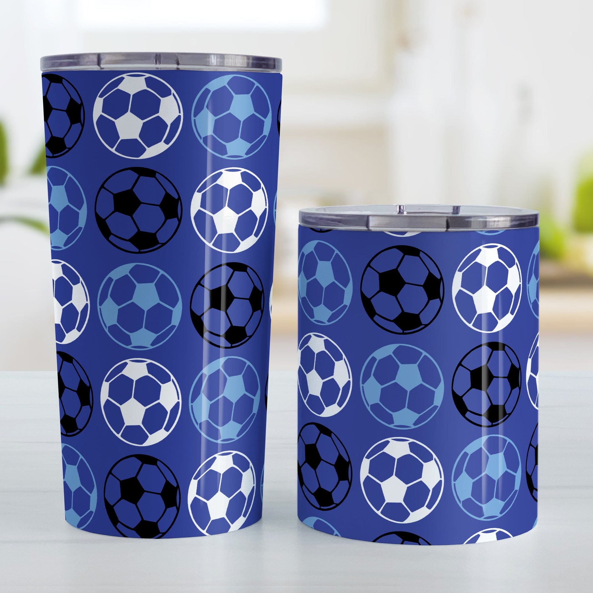 Alternating Dark Blue Soccer Balls Tumbler Cup at Amy's Coffee Mugs. Photo shows both sized cups next to each other.