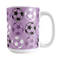 A 15oz white mug with a purple soccer ball pattern, over a white background