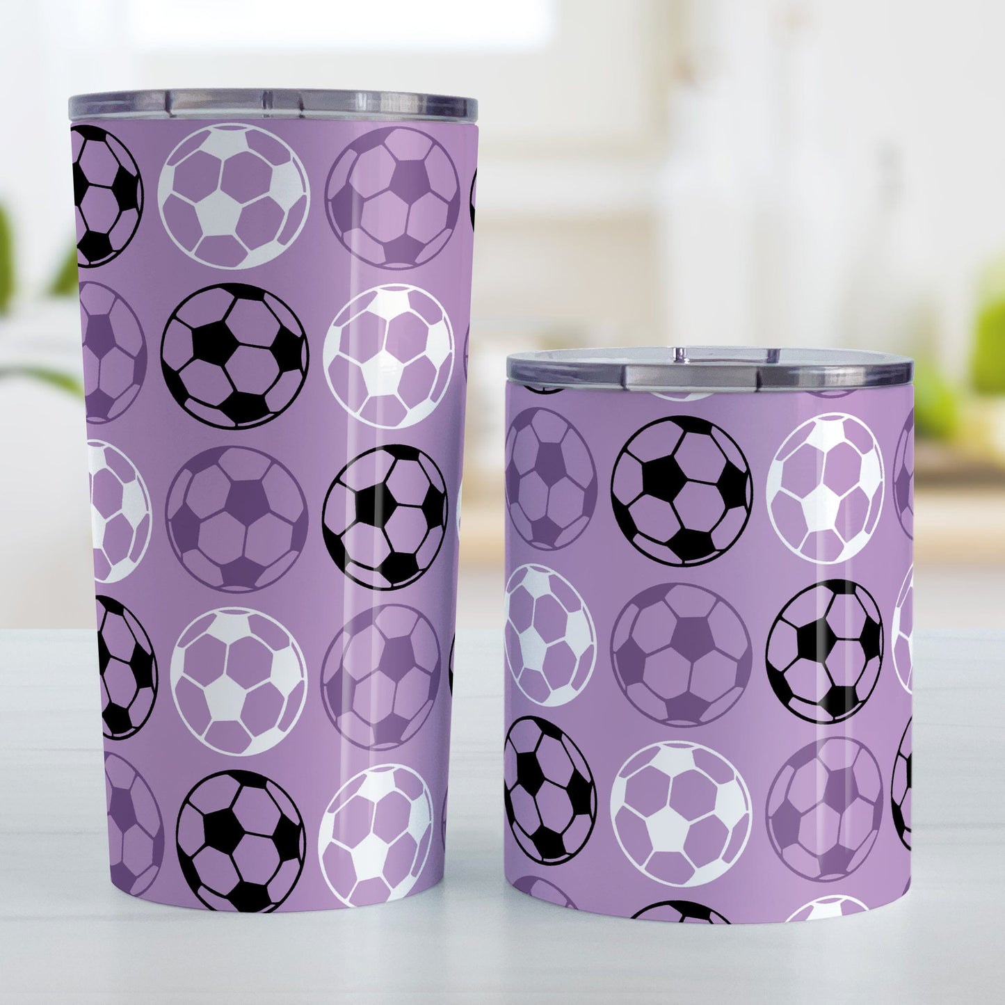 Alternating Purple Soccer Balls Tumbler Cup at Amy's Coffee Mugs. Photo shows both sized cups next to each other.