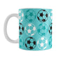 11oz white mug with a light teal soccer ball pattern, over a white background