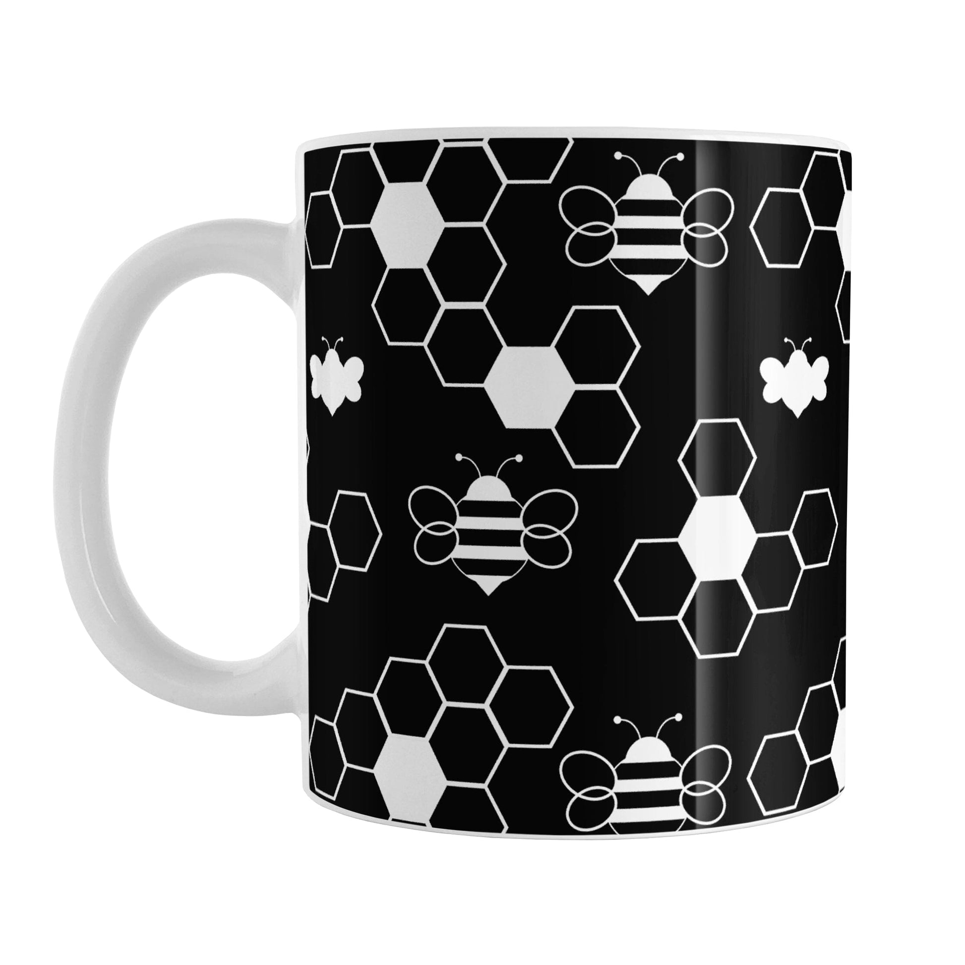 Black and White Bee Mug (11oz) at Amy's Coffee Mugs. A ceramic coffee mug designed with white line and silhouette bees and honeycomb in a sleek pattern over a black background color that wraps around the mug up to the handle.