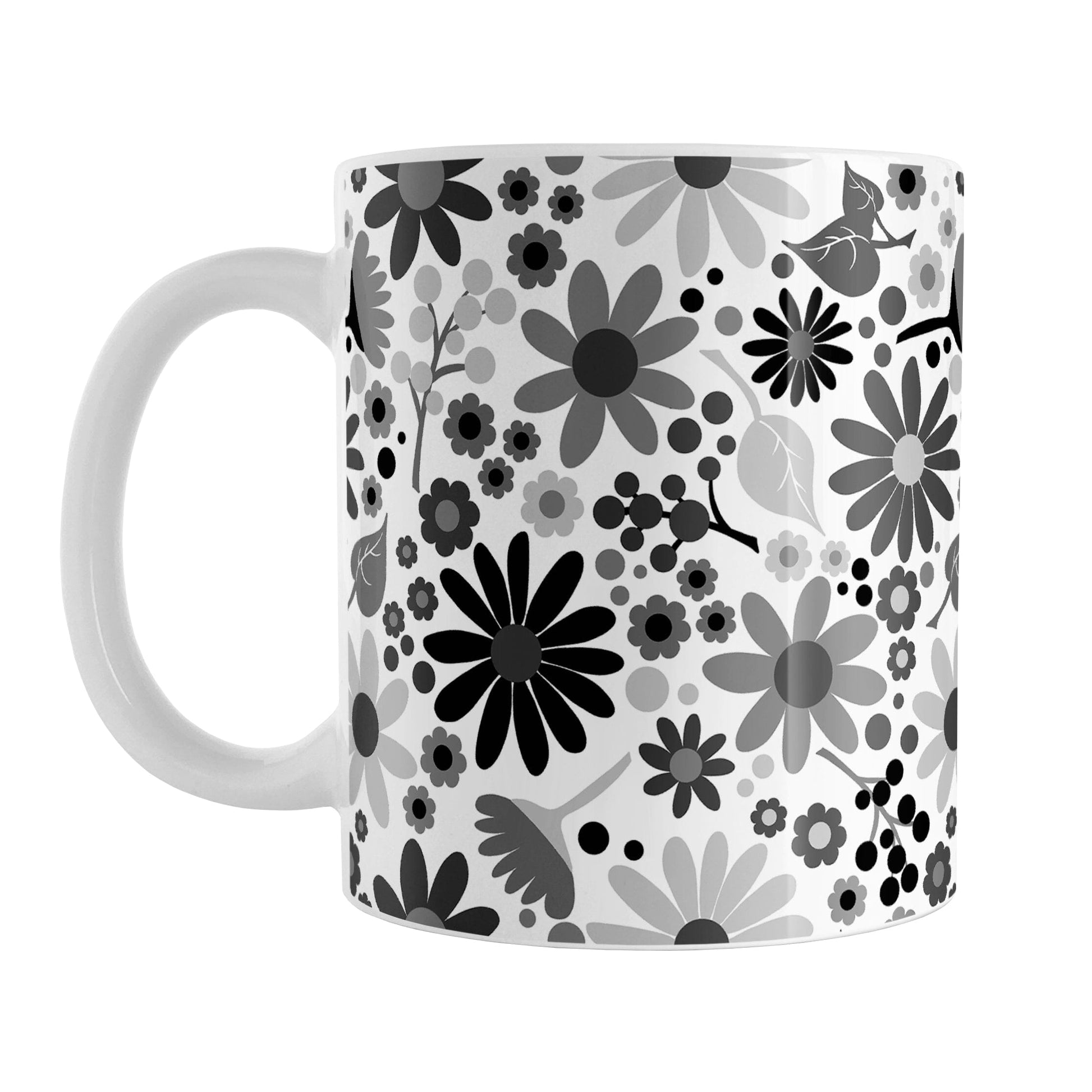 Black and White Flowers Mug (11oz) at Amy's Coffee Mugs. A ceramic coffee mug designed with pretty floral wildflowers in a stylish black and white color palette, with black, gray, and white flowers and leaves in a pattern that wraps around the mug up to the handle.