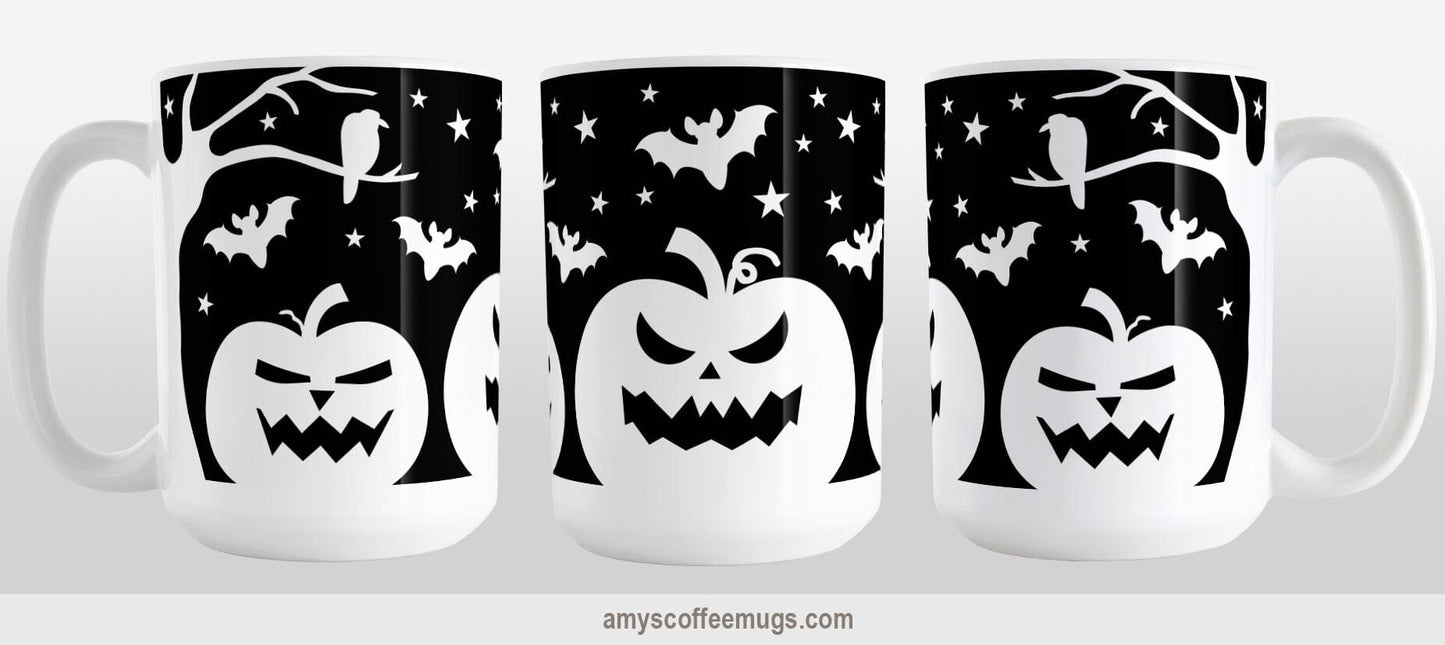 Black and White Halloween Mug (15oz) at Amy's Coffee Mugs. A ceramic coffee mug designed with white silhouette pumpkin jack o'lanterns, bats, stars and a raven in each leafless tree along each side of the design in a spooky scene over a black background that wraps around the mug up to the handle. Image shows three views of the mug to display the entire design.