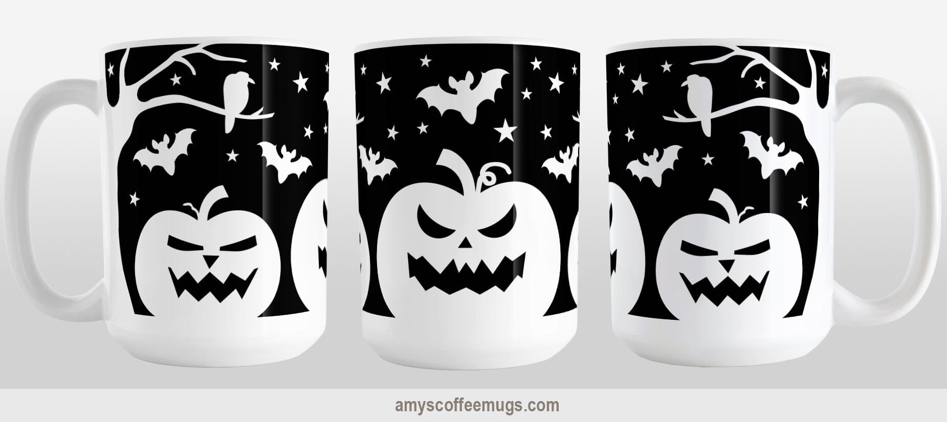 Black and White Halloween Mug (15oz) at Amy's Coffee Mugs. A ceramic coffee mug designed with white silhouette pumpkin jack o'lanterns, bats, stars and a raven in each leafless tree along each side of the design in a spooky scene over a black background that wraps around the mug up to the handle. Image shows three views of the mug to display the entire design.