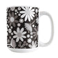 Mug with a floral pattern featuring white and gray flowers on a black background