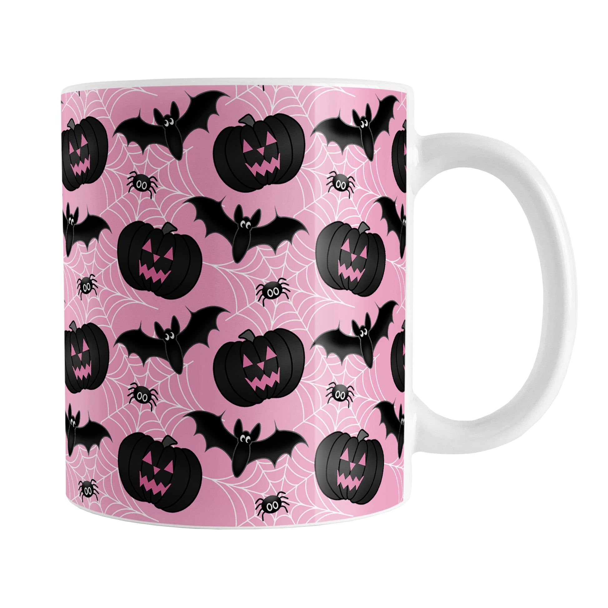 Black Pumpkins Bats and Spiders Pink Halloween Mug (11oz) at Amy's Coffee Mugs. A ceramic coffee mug designed with a pattern of black carved pumpkins, bats, and spiders in their webs in a pattern over a pink background color that wraps around the mug up to the handle.