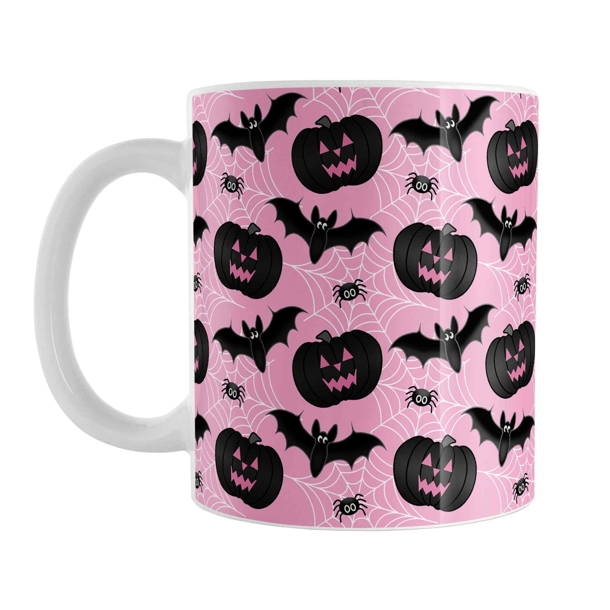 Black Pumpkins Bats and Spiders Pink Halloween Mug (11oz) at Amy's Coffee Mugs. A ceramic coffee mug designed with a pattern of black carved pumpkins, bats, and spiders in their webs in a pattern over a pink background color that wraps around the mug up to the handle.