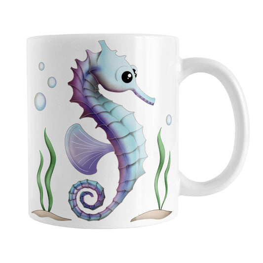 Blue and Purple Seahorse Mug (11oz) at Amy's Coffee Mugs. A ceramic coffee mug designed with an illustration of a blue and purple seahorse with seaweed and bubbles on both sides of the mug.
